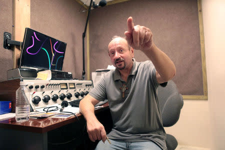 News anchorman Luis Penchi of the WAPA 680 radio station talks to Reuters in San Juan, Puerto Rico September 27, 2017. REUTERS/Alvin Baez