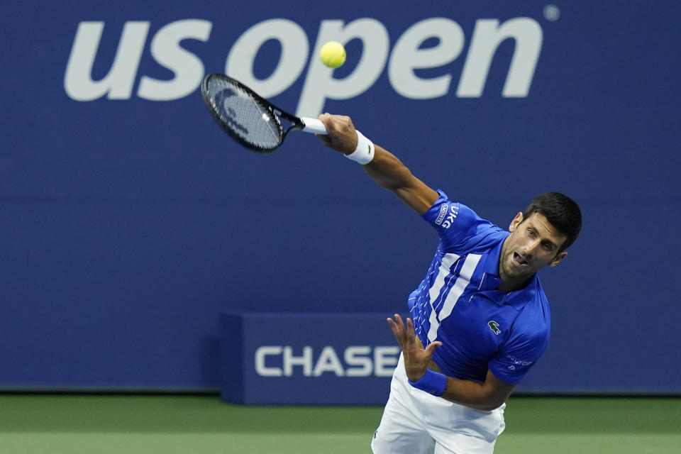 FILE - Novak Djokovic, of Serbia, serves to Jan-Lennard Struff, of Germany, during the third round of the U.S. Open tennis championships in New York, in this Friday, Sept. 4, 2020, file photo. Djokovic will begin his bid to win the U.S. Open for a men’s-record 21st major tennis championship and to complete a calendar-year Grand Slam by facing a player who comes through qualifying. (AP Photo/Frank Franklin II, File)