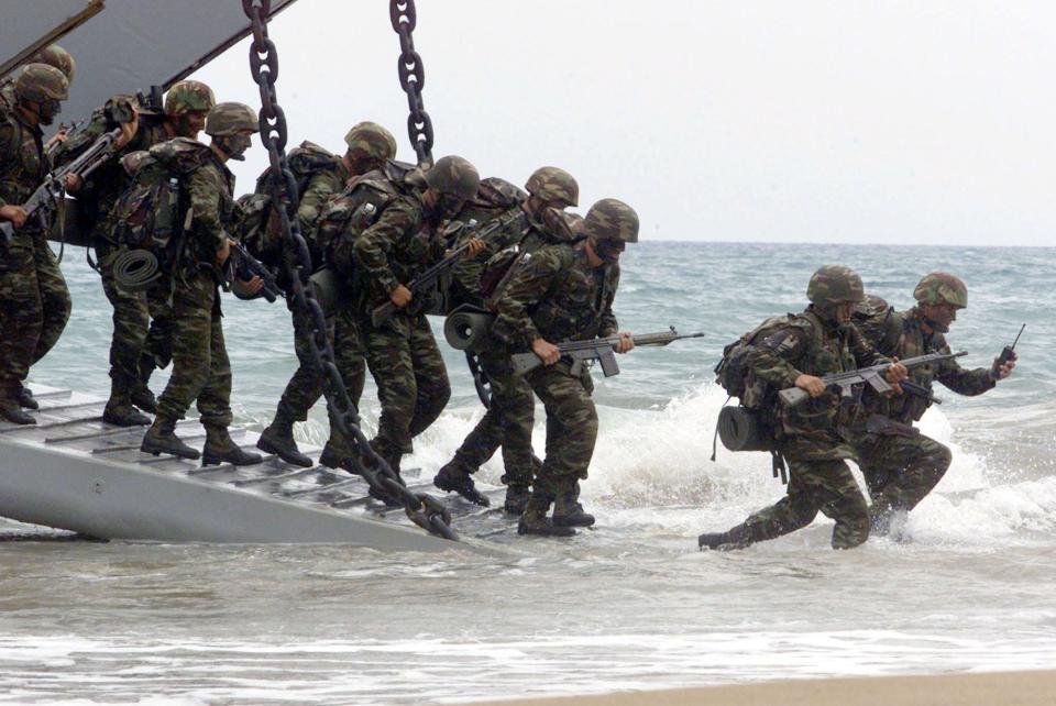 Turkish marines land at a coast near Greece's southwestern village of Kyparissia during a phase of the NATO " Dynamic Mix" exercise in June 2000.