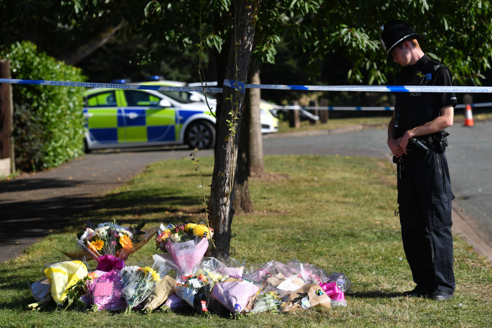 Floral tributes placed in Edgar Close, next to Wigginton Park, Tamworth, Stafffordshire after a 20-year-old woman died there on Thursday evening. Police believe the young woman is Keeley Bunker.