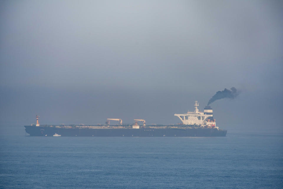 A view of the Grace 1 supertanker in the British territory of Gibraltar, Friday, Aug. 16, 2019. The tanker was seized last month in a British Royal Navy operation off Gibraltar. The lawyer representing the captain of the Iranian supertanker caught in a diplomatic standoff said Friday that the captain no longer wants to be in command of the ship, which is in need of repairs that could prevent its immediate departure from Gibraltar. (AP Photo/Marcos Moreno)