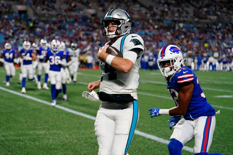 Carolina Panthers quarterback Sam Darnold runs form a touchdown against the Buffalo Bills during the second half of an NFL preseason football game on Friday, Aug. 26, 2022, in Charlotte, N.C. (AP Photo/Jacob Kupferman)