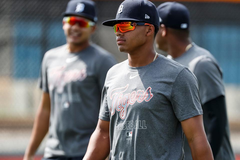 Infielder Wenceel Perez, center, warms up for practice during Detroit Tigers spring training at TigerTown in Lakeland, Fla., Thursday, Feb. 20, 2020.