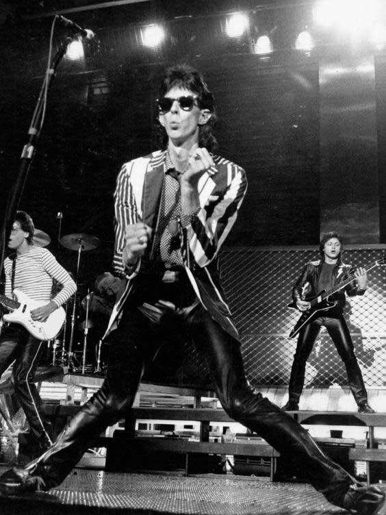 Ocasek and the band in concert during the 1980s (MediaPunch/Rex)