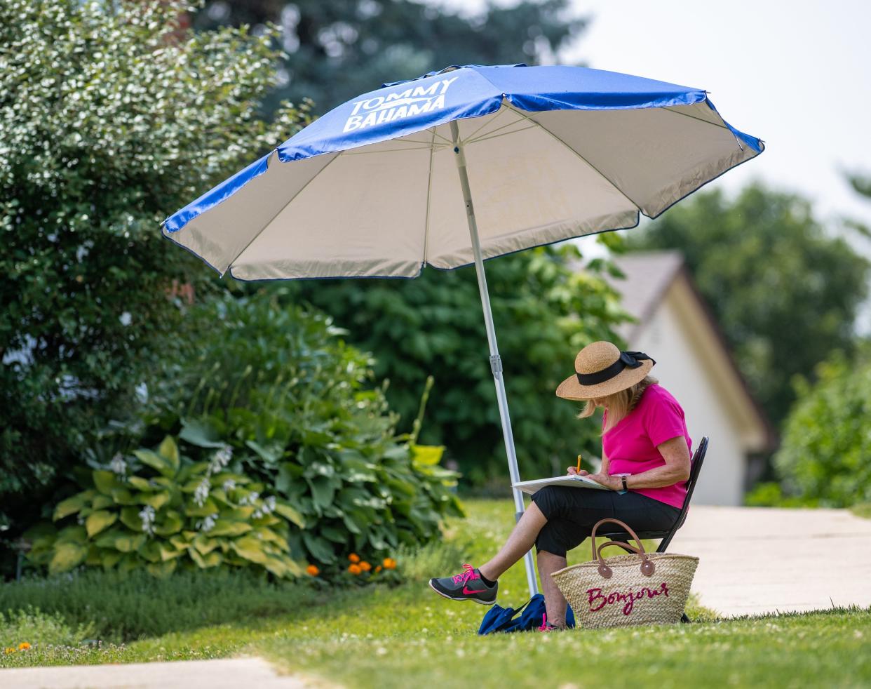 Carrie Nocera of Pickerington sketches a watercolor painting as part of Central Ohio Plein Air members creating plein air art June 25 at the Gardens at Gantz Farm in Grove City.