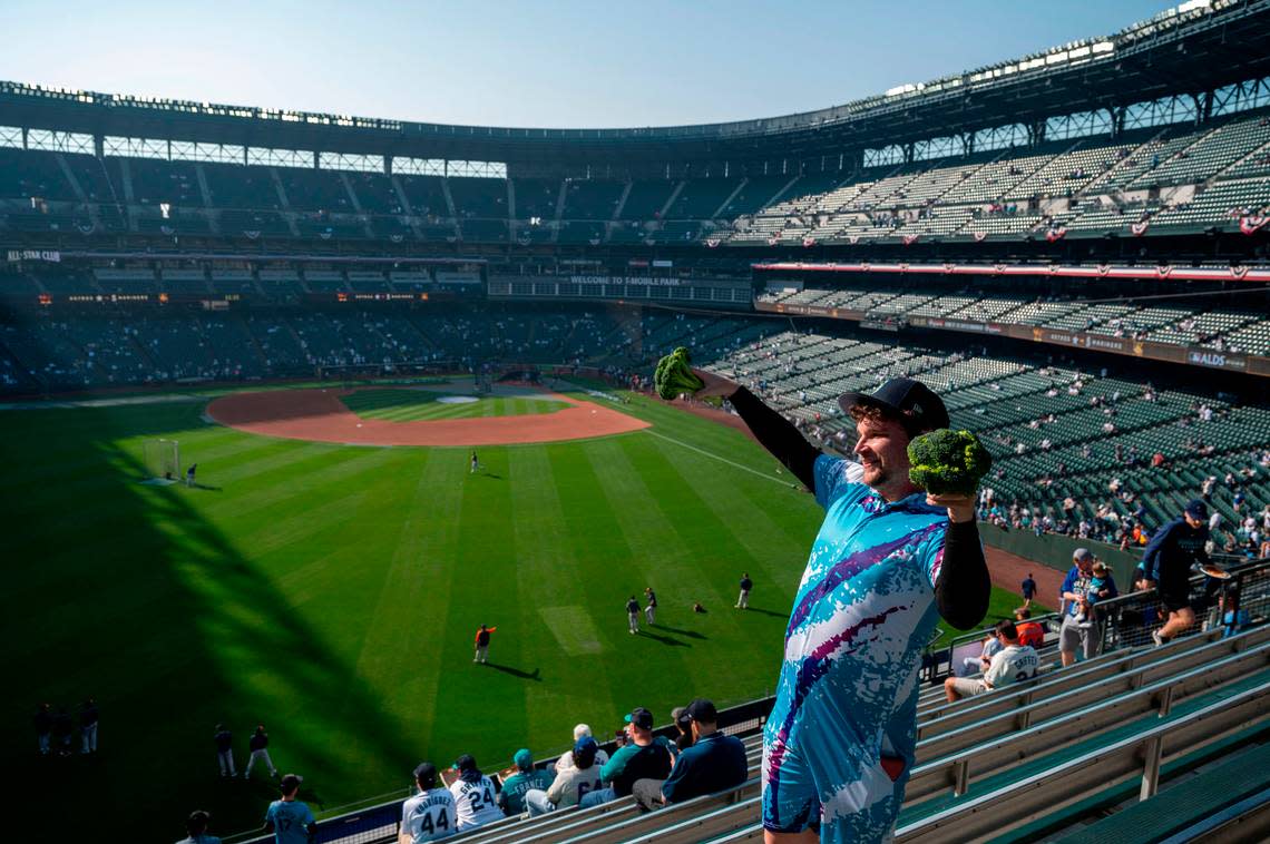 Jim Stewart Allen, also known as “Broccoli Guy” dances in the left-field bleachers prior to the start of game 3 of the ALDS on Saturday, Oct. 15, 2022, at T-Mobile Park in Seattle.