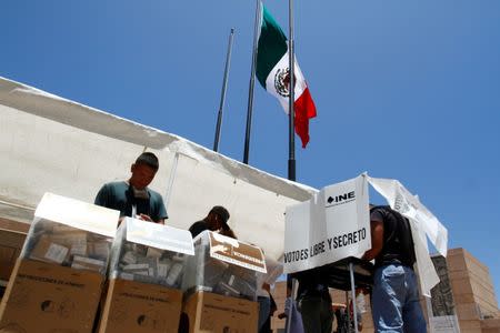 Mexicans living in the U.S. cast their vote a a polling station in Tijuana, Mexico, July 1, 2018. REUTERS/Jorge Dunes