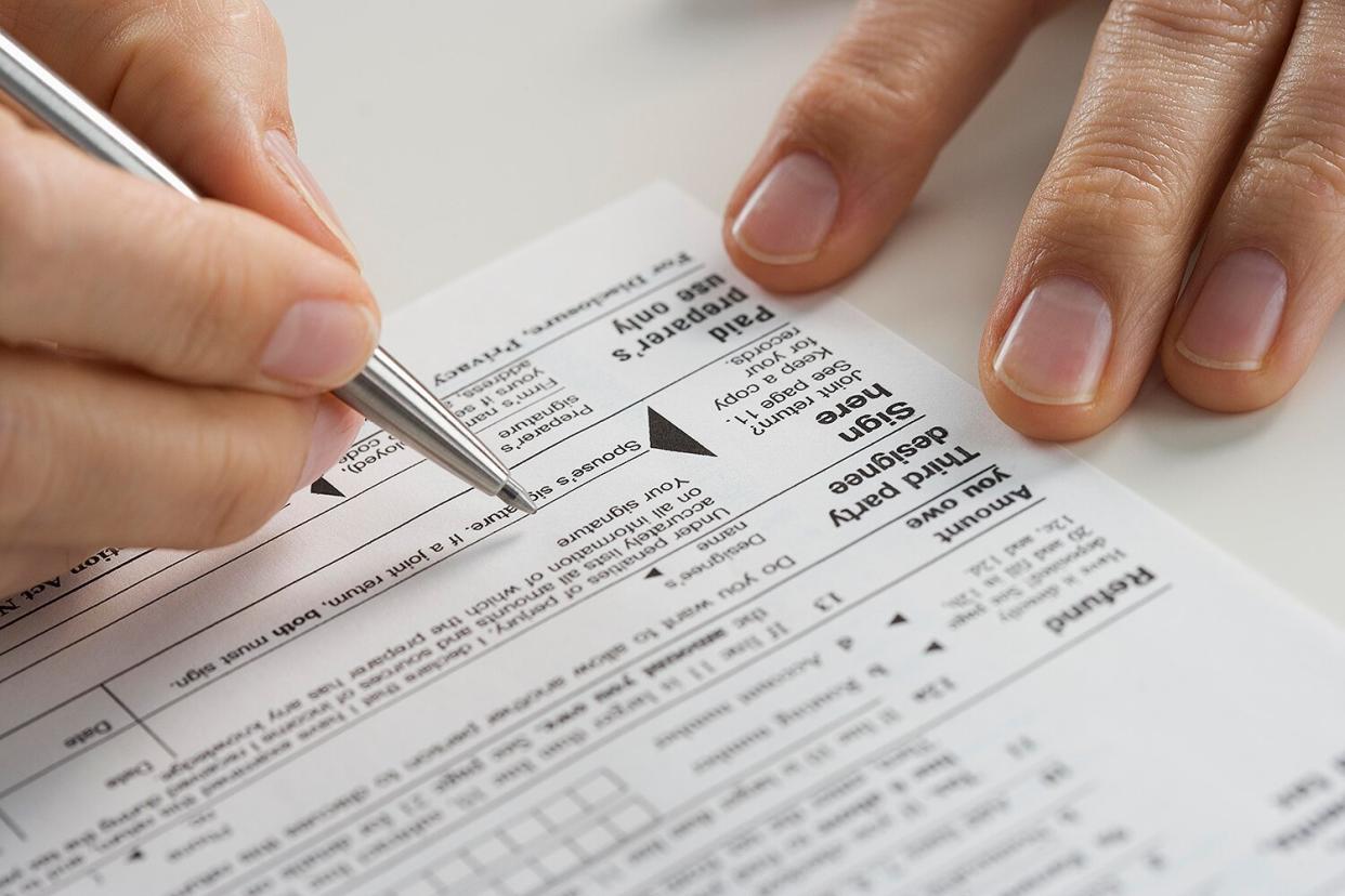 Closeup of hands with tax form