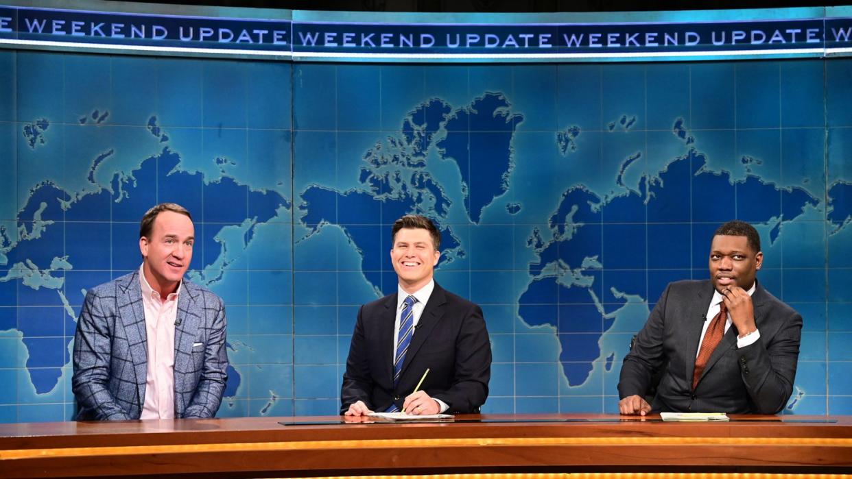 Peyton Manning, anchor Colin Jost, and anchor Michael Che during Weekend Update on Saturday Night Live