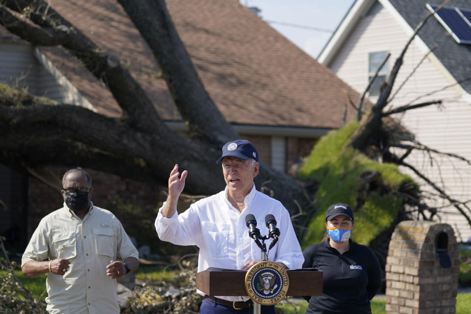 President Joe Biden talks as he tours a neighborhood impacted by Hurricane Ida, Friday, Sept. 3, 2021, in LaPlace, La. (AP Photo/Evan Vucci)