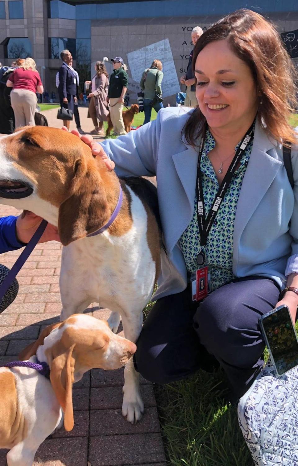 Dawn Baumgartner Vaughan, The News & Observer’s Capitol Bureau chief, greets dogs during the American Kennel Club’s Canines at the Capitol Day on Thursday, March 30, 2023, at Halifax Mall in Raleigh, N.C.