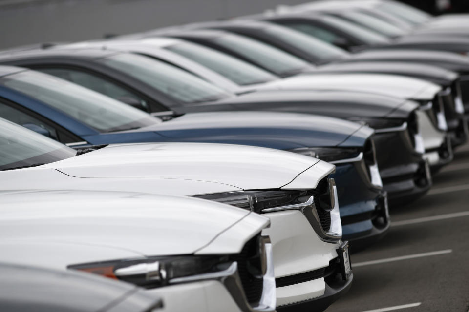 FILE- In this May 19, 2019, file photo, a line of unsold 2019 CX-5 sports-utility vehicles sits at a Mazda dealership in Littleton, Colo. On Friday, June 14, the Commerce Department releases U.S. retail sales data for May. (AP Photo/David Zalubowski, File)