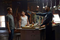 This image released by Relativity Media shows, from left, Paul Walker, David Belle, Kwasi Songui and RZA in a scene from "Brick Mansions." (AP Photo/Relativity Media, Philippe Bosse)