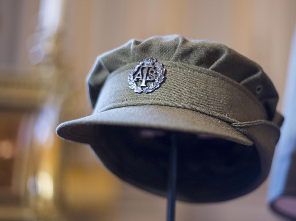 Embargoed to 2100 Friday May 08 File photo dated 04/07/16 of an Auxiliary Territorial Service cap, worn by Princess Elizabeth whilst serving in the wartime ATS, on display at Buckingham Palace in London. The Queen was surrounded by historic personal mementos from the war years as she addressed the nation on the 75th anniversary of VE Day.