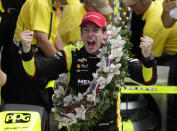 FILE - Simon Pagenaud celebrates after winning the Indianapolis 500 IndyCar auto race at Indianapolis Motor Speedway, Sunday, May 26, 2019, in Indianapolis. Simon Pagenaud won back-to-back Rolex watches driving for a team that isn't at Daytona International Speedway to defend its two titles in the prestigious endurance race. But Pagenaud could not have driven anyway: the Frenchman is still recovering from injuries suffered in a July crash during IndyCar practice. (AP Photo/Michael Conroy, File)
