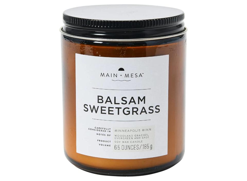 Give the gift of fragrance with this warm balsam soy candle. (Source: Amazon)