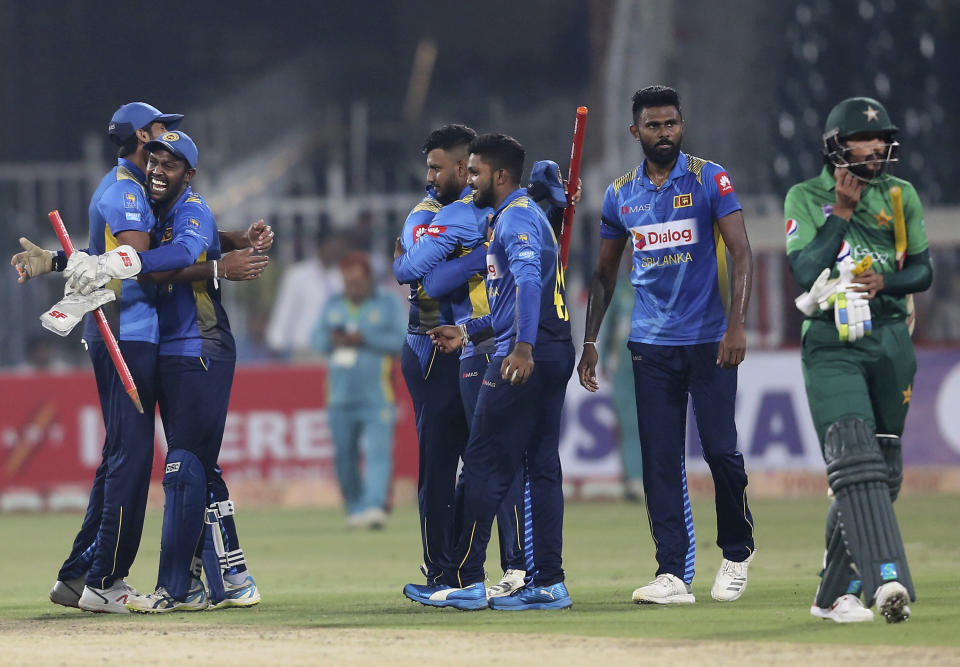 Sri Lankan players celebrate their victory against Pakistan in the second Twenty20 match in Lahore, Pakistan, Monday, Oct. 7, 2019. Sri Lanka's inexperienced team earned another emphatic 35-run victory over top-ranked Pakistan in the second Twenty20 on Monday for an unassailable 2-0 lead in the three-match series.(AP Photo/K.M. Chaudary)