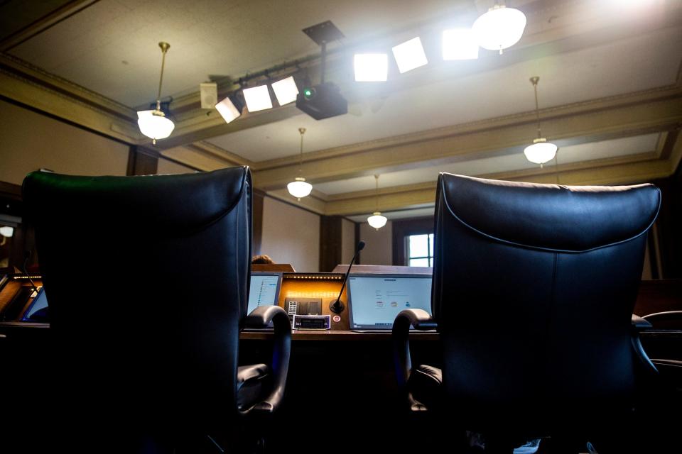 The Des Moines city council chamber is mostly empty during a virtual council meeting on Monday, March 23, 2020, at City Hall in Des Moines' East Village. The City Council held the virtual meeting, participating from their homes, because of the coronavirus. 