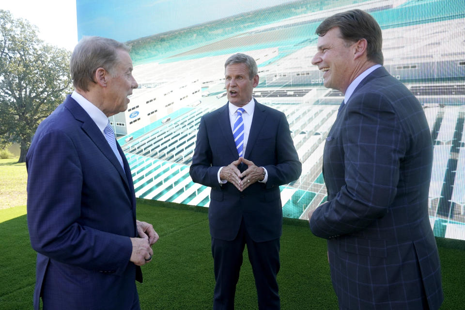 Ford Executive Chairman Bill Ford, left, and Jim Farley, Ford president and CEO, right, talk with Tennessee Gov. Bill Lee, center, after a presentation on the planned factory to build electric F-Series trucks and the batteries to power future electric Ford and Lincoln vehicles Tuesday, Sept. 28, 2021, in Memphis, Tenn. The plant in Tennessee is to be built near Stanton, Tenn. (AP Photo/Mark Humphrey)