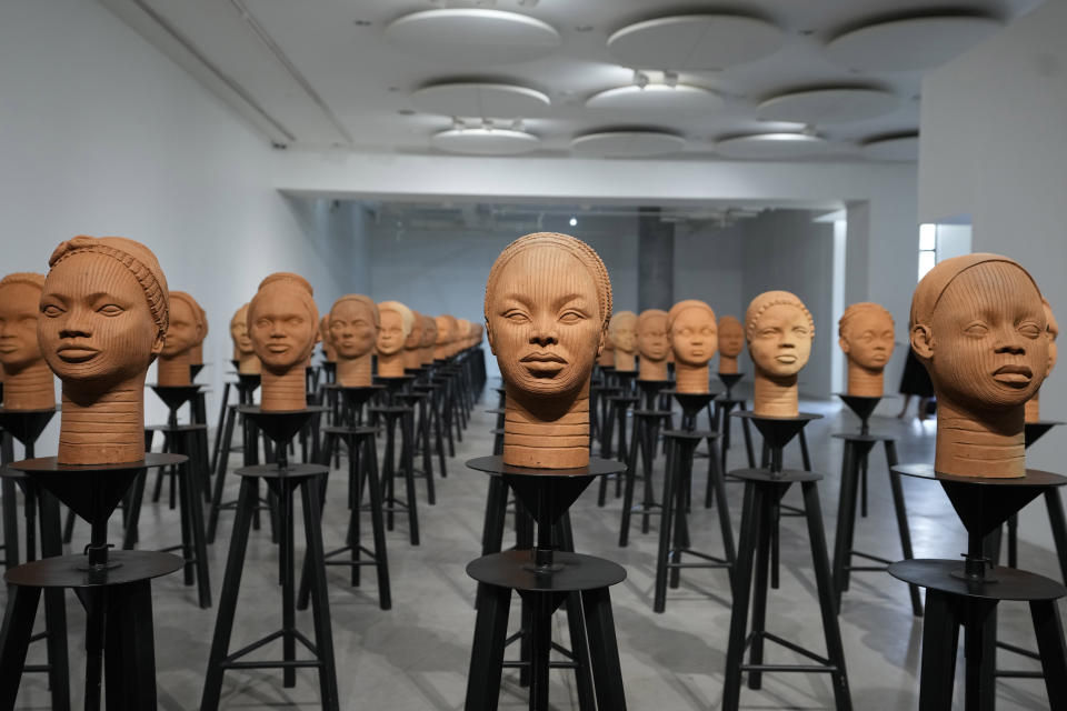 FILE- Sculptures created by French artist Prune Nourry, inspired by ancient Nigerian Ife terracotta heads, titled "Statues Also Breathe," and representing the remaining 108 Chibok still in captivity are displayed in Lagos, Nigeria, Tuesday, Dec. 13, 2022. A new film in Nigeria is being screened to remember the nearly 100 schoolgirls who are still in captivity 10 years after they were seized from their school in the country’s northeast. The film captured a flurry of emotions as heartbroken mothers reminisced about life when their daughters were home. (AP Photo/Sunday Alamba, File)