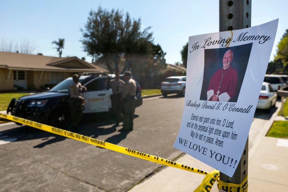 Los Angeles County Sheriff deputies guard the entrance to the street of Bishop David O'Connell's home in Hacienda Heights, Calif., on Sunday.