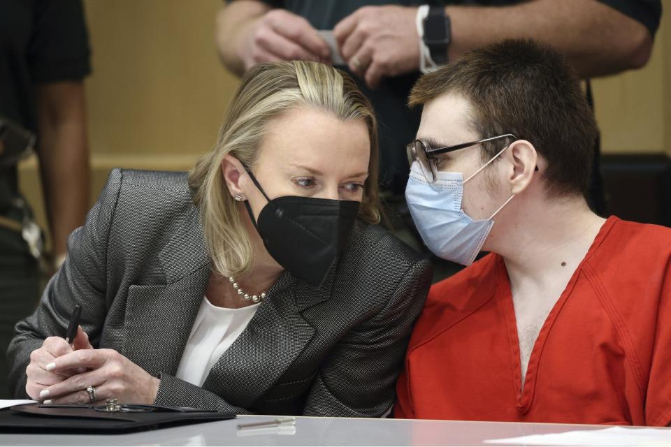 Assistant Public Defender Melisa McNeill speaks with her client, Parkland school shooter Nikolas Cruz, during a hearing at the Broward County Courthouse in Fort Lauderdale, on Feb. 2, 2022.