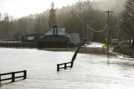 A farm is pictured near flood waters of the Snoqualmie River off 310th Avenue NE during a storm in Carnation, Washington December 9, 2015. REUTERS/Jason Redmond