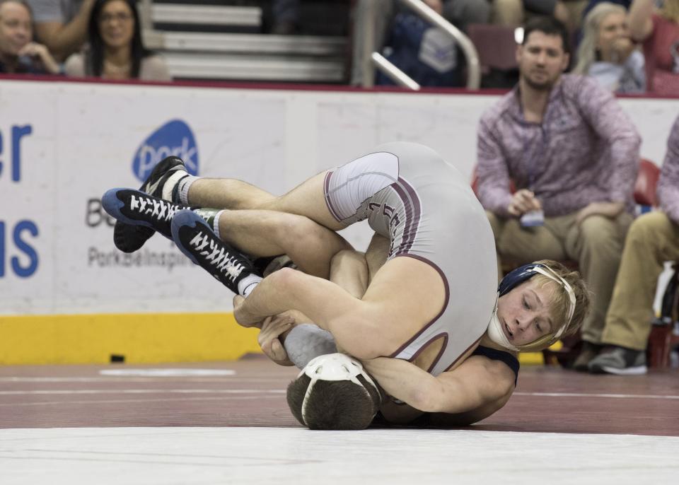 Hopewell's Jacob Ealy tries to turn Mechanicsburg's Nick Tewell during last year's PIAA tournament. Ealy won the Class AA 138-pound championship Saturday at the Giant Center in Hershey. [BCT File]