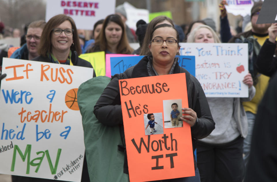 Teachers march to a protest rally at the state Capitol. (Photo: J Pat Carter via Getty Images)