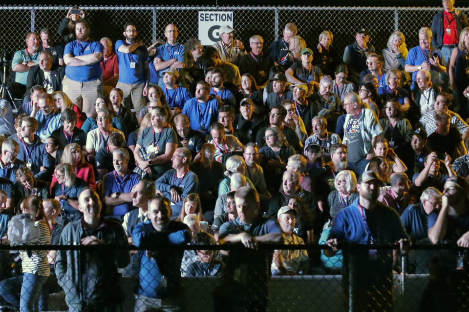 Spectators wait for the launch of NASA's new moon rocket launch at Pad 39B at the Kennedy Space Center in Cape Canaveral, Fla., Wednesday, Nov. 16, 2022. This launch is the first flight test of the Artemis program. (AP Photo/Terry Renna)