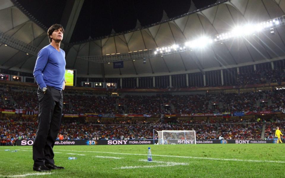 Joachim Low in blue top and trousers - GETTY IMAGES