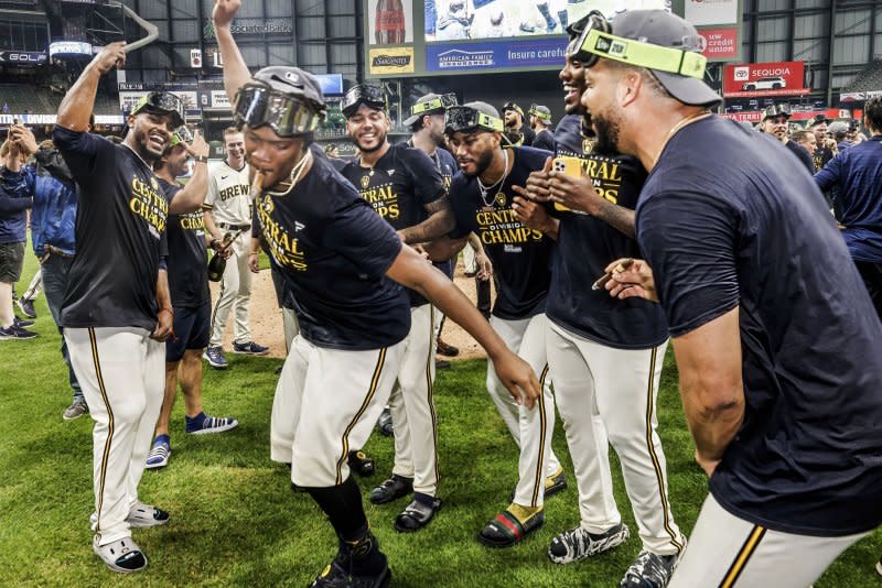 The Milwaukee Brewers celebrate after winning the National League Central title Tuesday at American Family Field in Milwaukee. Photo by Tannen Maury/UPI