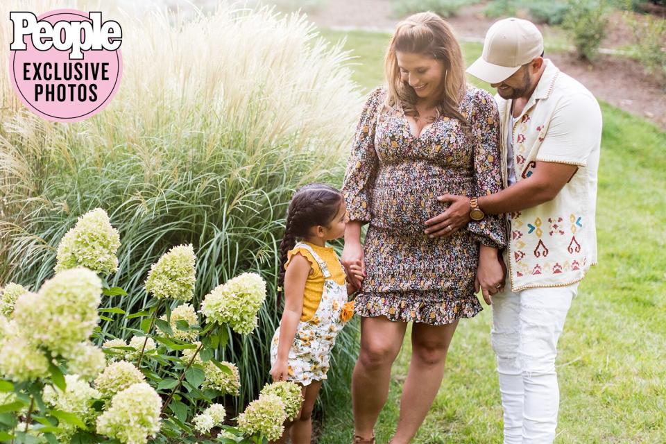 Frank Ray and wife with child