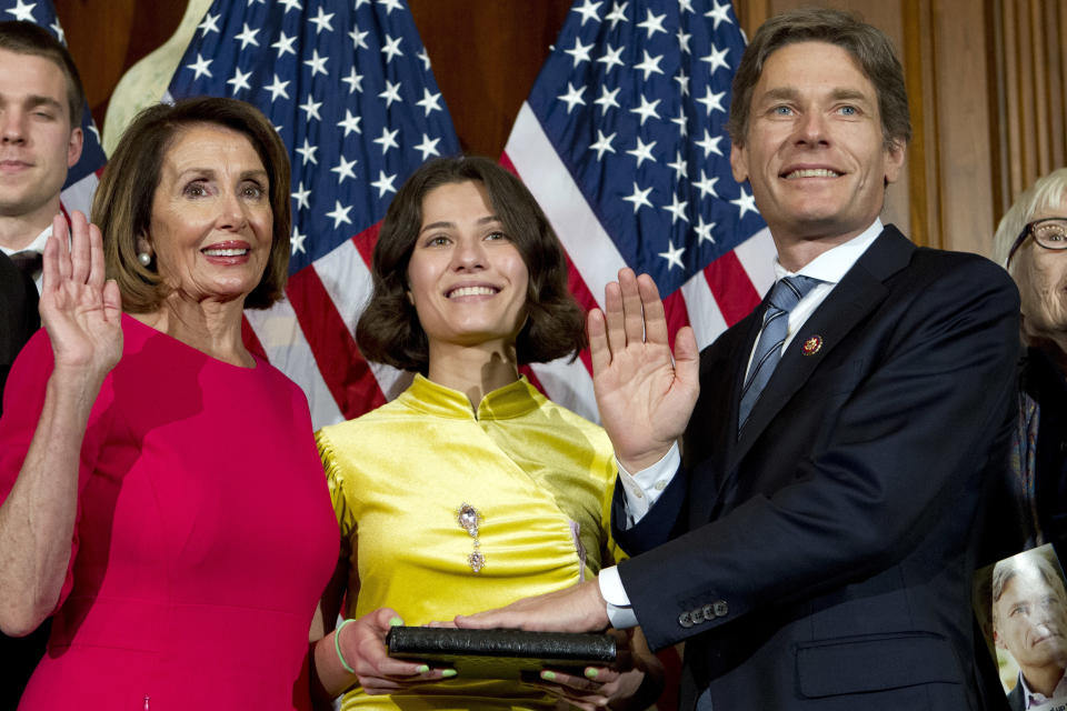 FILE - In this Jan. 3, 2019, file photo, House Speaker Nancy Pelosi of Calif., administers the House oath of office to Rep. Tom Malinowski D-N.J., during ceremonial swearing-in on Capitol Hill in Washington. The Republican pathway for recapturing House control in next year’s election charges straight through the districts of the most vulnerable Democratic incumbents, especially freshmen. But it won’t be easy, based on early but formidable cash advantages those lawmakers have amassed. Malinowski who defeated a GOP incumbent in November, has doubled the fund-raising of Tom Kean Jr., (AP Photo/Jose Luis Magana, File)