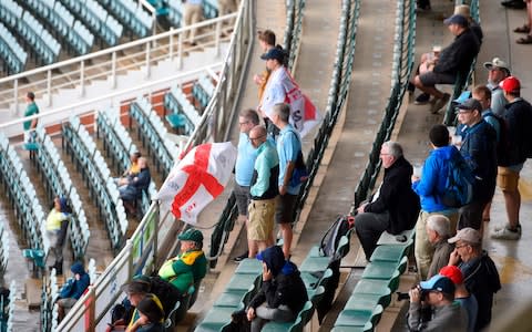 England cricket supporters wait in the stands for the match to start after rain has delayed play during the first day of the fourth Test cricket match between South Africa and England at the Wanderers Stadium in Johannesburg on January 24, 2020. - Credit: Getty Images