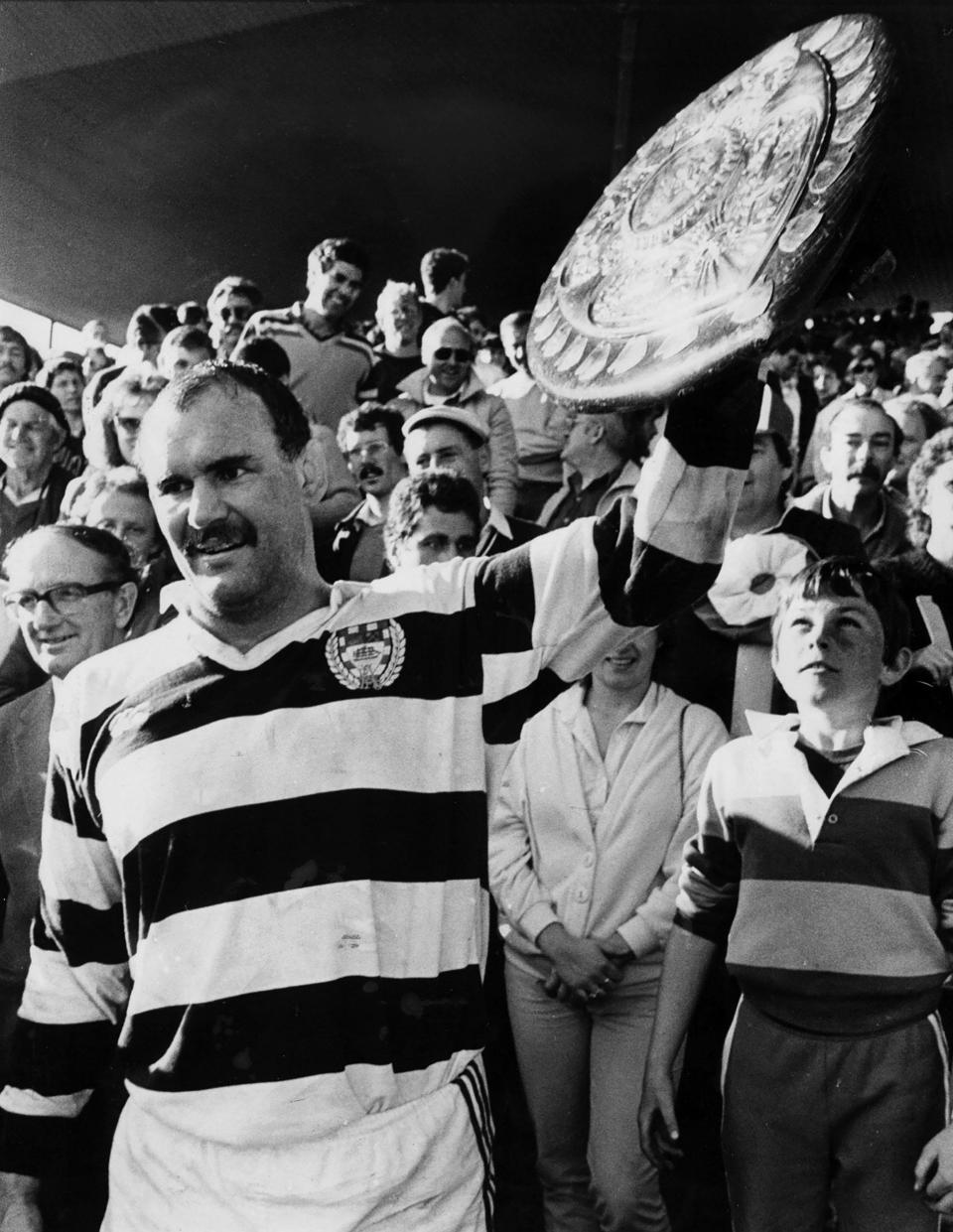 Haden, the Auckland captain, holds up the Ranfurly Shield after victory against Canterbury in Christchurch in 1985  - Paul Estcourt/New Zealand Herald via AP