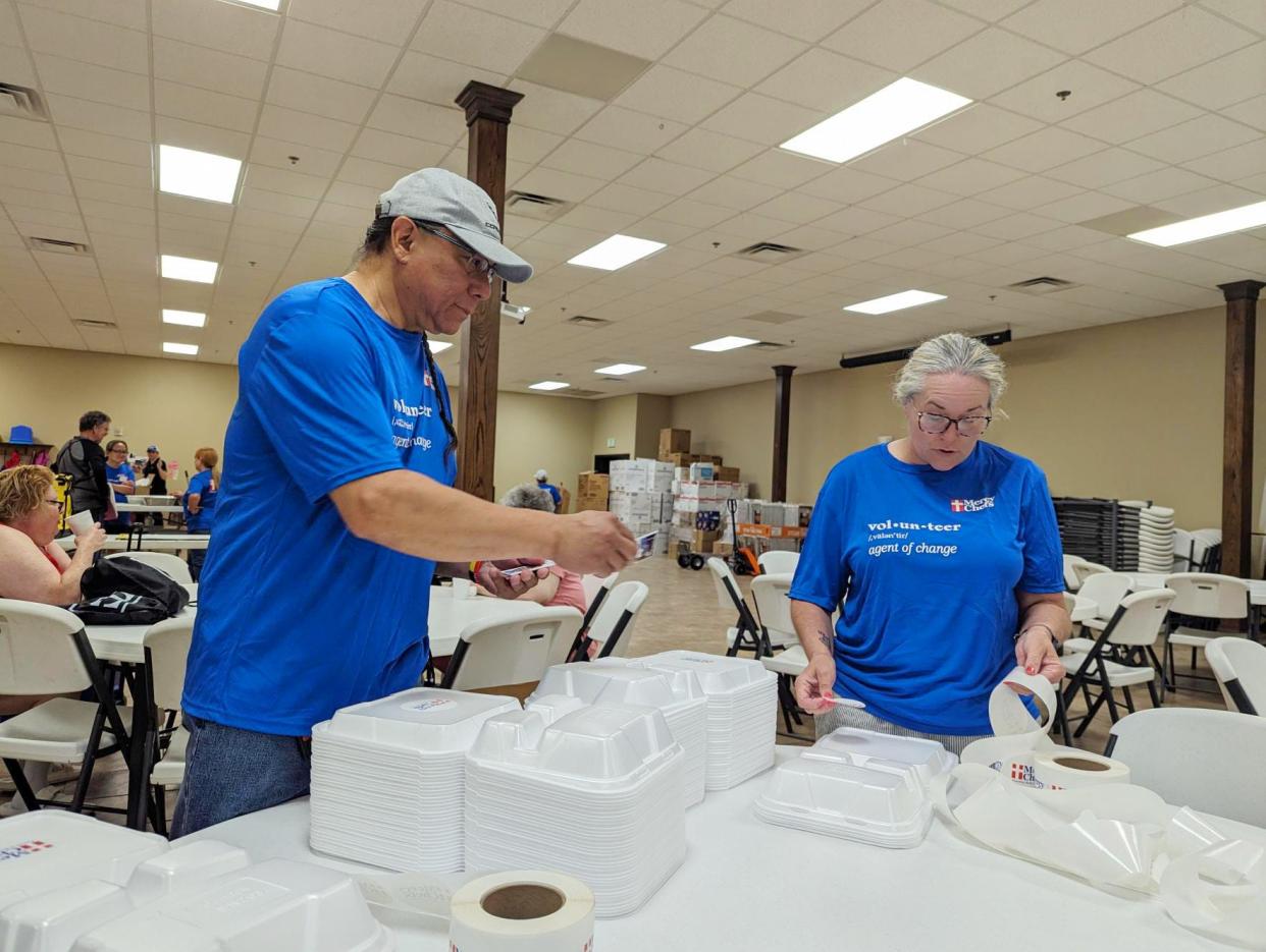 Gene and Jenna Smith volunteer with Mercy Chefs prepare meals in Sulphur after a devastating tornado destroyed several buildings and homes.