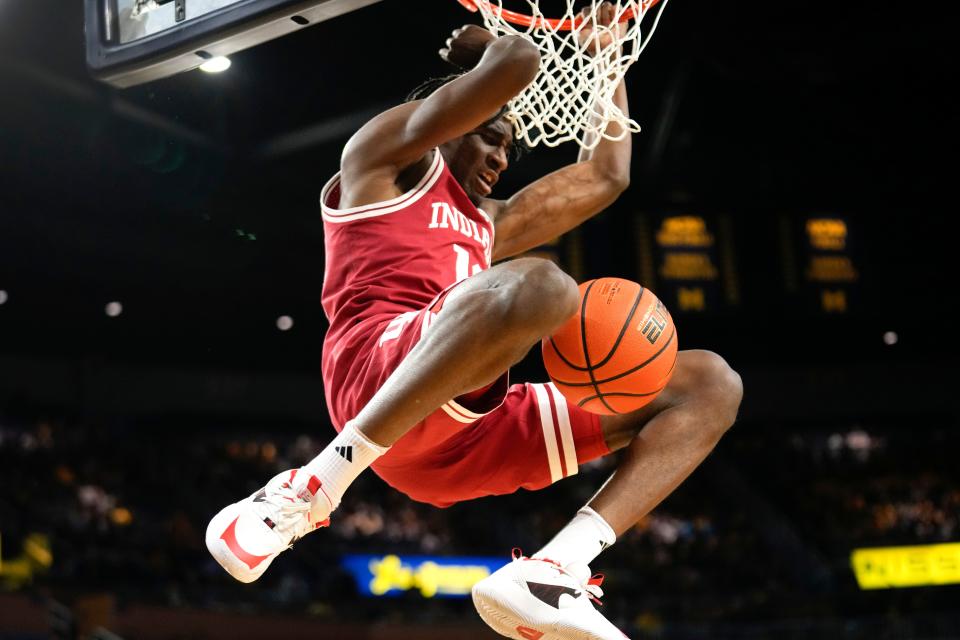 Indiana forward Kaleb Banks (10) dunks against Michigan in the first half of an NCAA college basketball game in Ann Arbor, Mich., Tuesday, Dec. 5, 2023. (AP Photo/Paul Sancya)