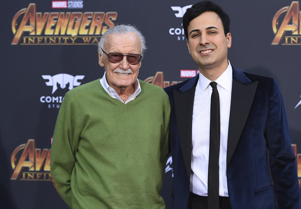 FILE - In this April 23, 2018, file photo, Stan Lee, left, and Keya Morgan arrive at the world premiere of "Avengers: Infinity War" in Los Angeles. Morgan, the former business manager of Lee has been arrested on elder abuse charges involving the late comic book icon. Los Angeles police say Morgan was taken into custody in Arizona early Saturday, May 25, 2019, on an outstanding arrest warrant. Morgan was charged earlier this month with felony allegations of theft, embezzlement, forgery or fraud against an elder adult, and false imprisonment of an elder adult. (Photo by Jordan Strauss/Invision/AP, File)