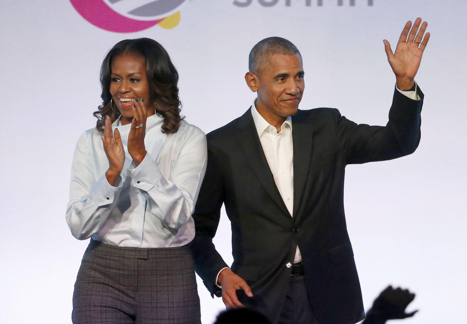 FILE - In this Oct. 31, 2017, file photo, former President Barack Obama, right, and former first lady Michelle Obama appear at the Obama Foundation Summit in Chicago. Obama said in a commencement speech Sunday, June 7, 2020, that the nationwide protests following the recent deaths of unarmed black women and men including George Floyd were fueled from "decades worth of anguish, frustration, over unequal treatment and a failure to perform police practices." (AP Photo/Charles Rex Arbogast, File)