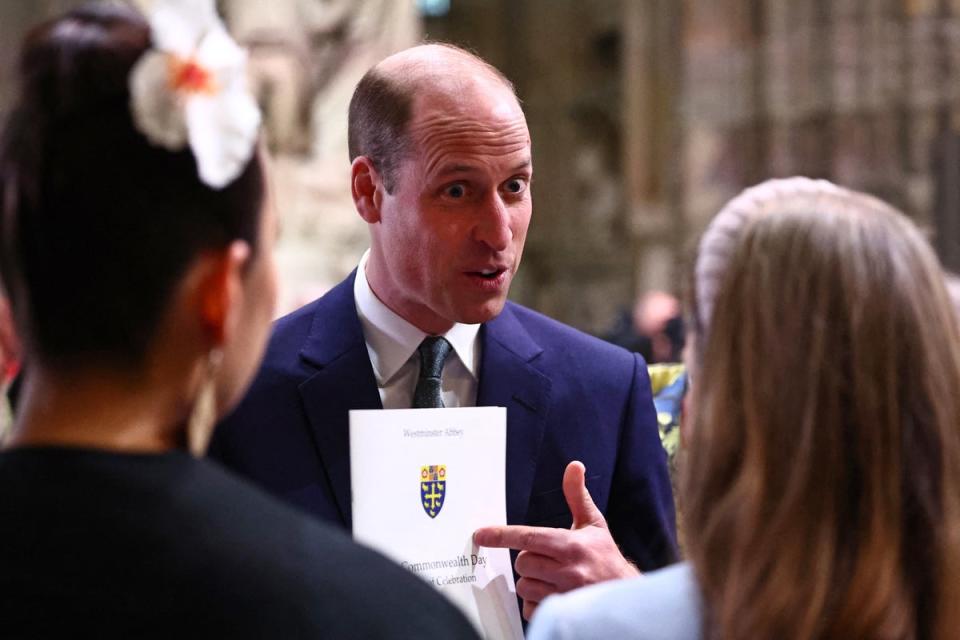 The Prince of Wales speaks with guests as he attends an annual Commonwealth Day service ceremony at Westminster Abbey in London on Monday (POOL/AFP/Getty)