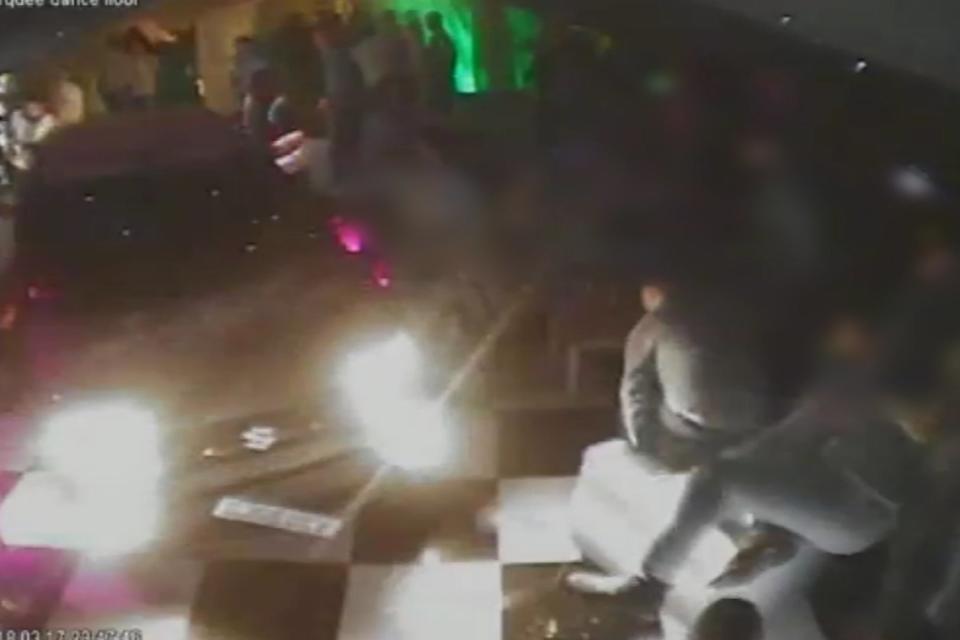 CCTV captures moment man drives car onto crowded club's dancefloor