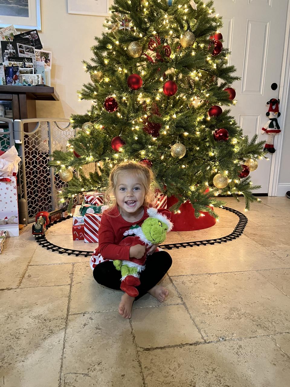 Carter points to her Grinch's heart that grew three times!