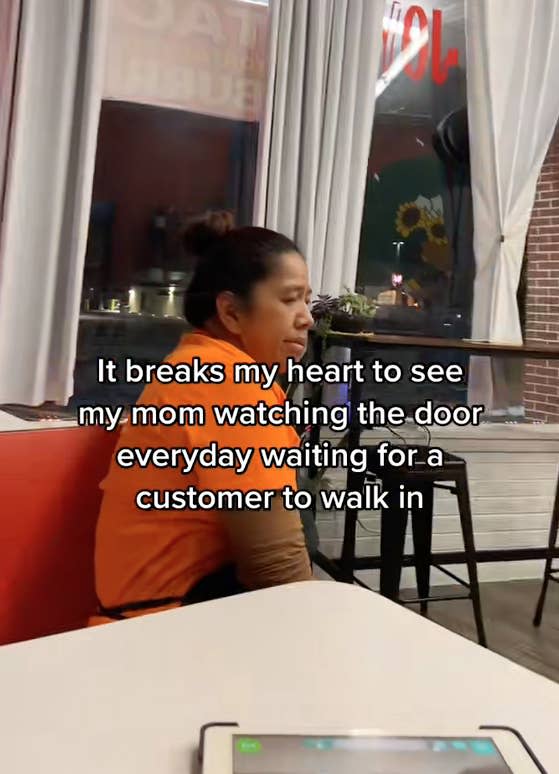 screeshot of TikTok with mother sitting sadly and text "it breaks my heart to see my mom watching the door every day waiting for a customer to walk in"