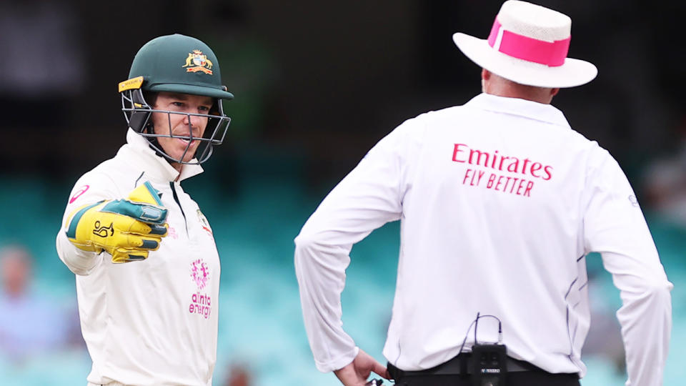 Australia's captain Tim Paine speaks with an umpire during  the third cricket Test match between Australia and India at the Sydney Cricket Ground. (Photo by DAVID GRAY/AFP via Getty Images)