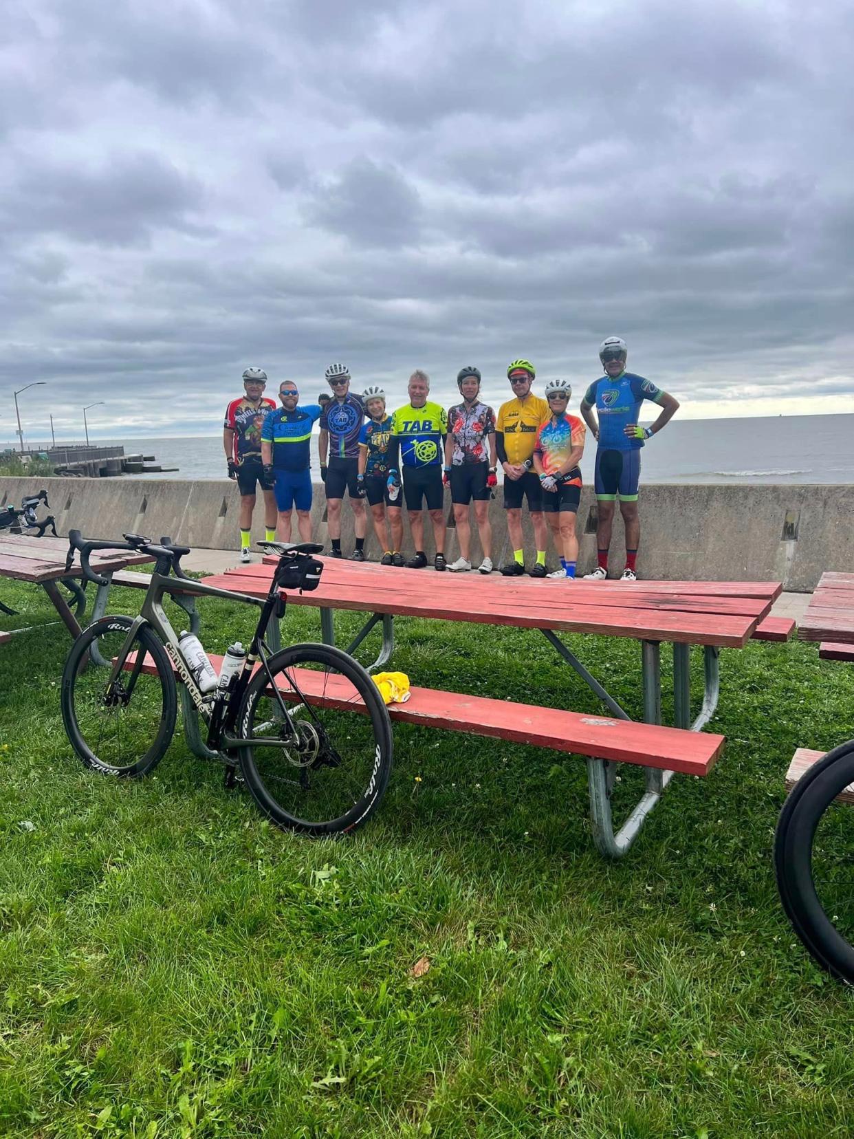 Cyclists from the Toledo Area Bicyclists are shown at the Luna Pier rest stop during Saturday's Cornerstone 100 Lake Erie Bicycle Tour. More than 100 riders took part.