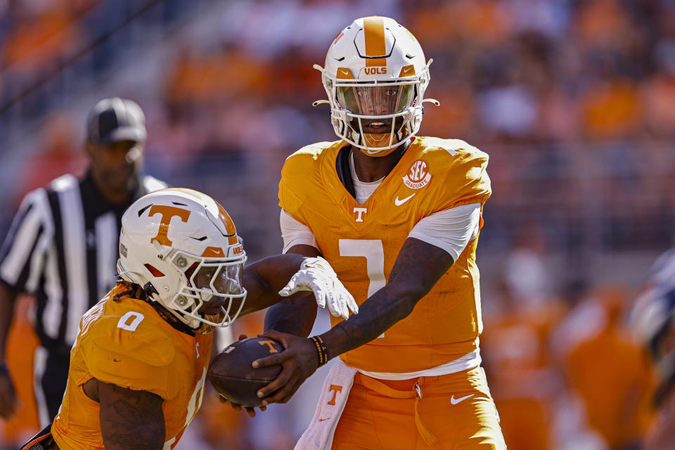 Tennessee quarterback Joe Milton III (7) hands the ball off to running back Jaylen Wright (0) during the first half of an NCAA college football game against UTSA Saturday, Sept. 23, 2023, in Knoxville, Tenn. (AP Photo/Wade Payne)
