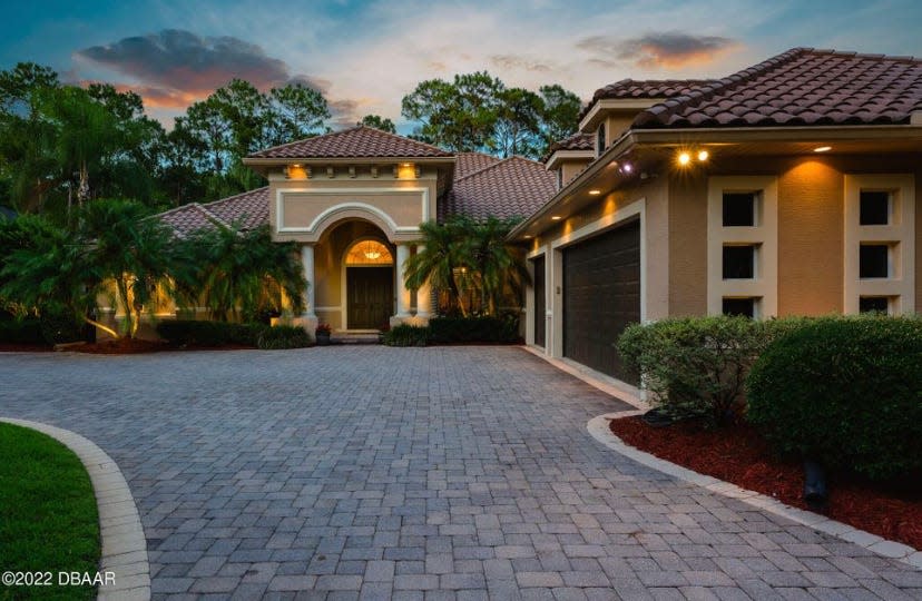 This custom estate in the Ormond Beach community of Hunters Ridge is an entertainer's dream.
