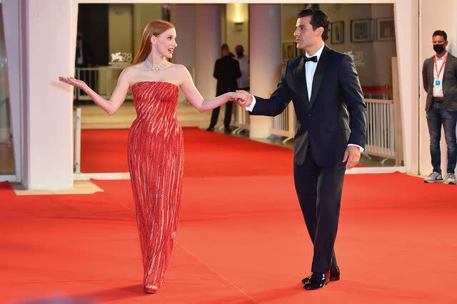 Stephane Cardinale - Corbis/Corbis via Getty Jessica Chastain and Oscar Isaac attend <em>Scenes from a Marriage</em> on Sept. 4, 2021, in Venice, Italy red carpet