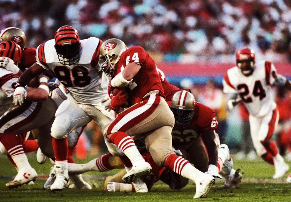 Jan 22, 1989; Miami, FL, USA; FILE PHOTO; San Francisco 49ers running back Tom Rathman (44) carries the ball against Cincinnati Bengals defensive end David Grant (98) during Super Bowl XXIII at Joe Robbie Stadium. The 49ers defeated the Bengals 20-16. Mandatory Credit: RVR Photos-USA TODAY Sports